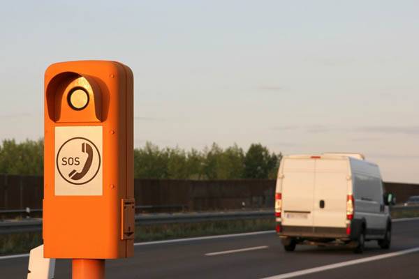 roadside assistance phone box next to motorway road